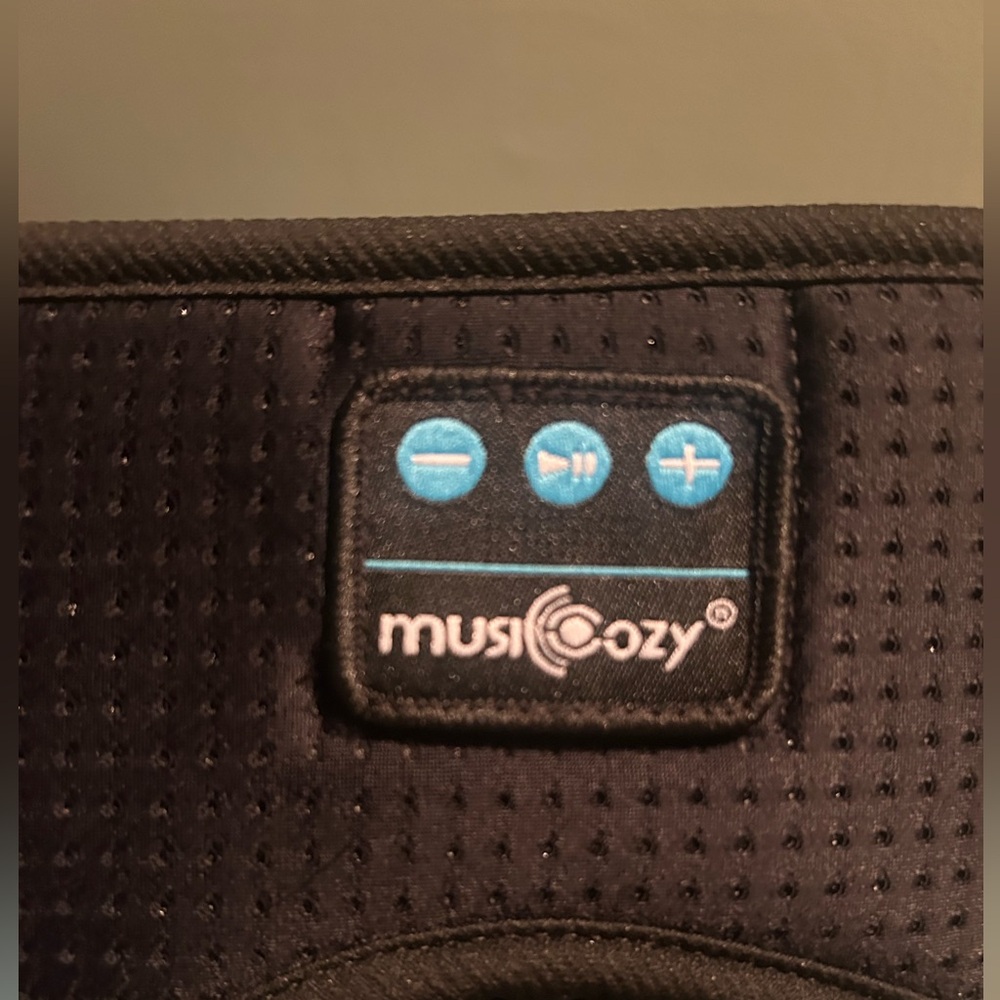 Sleep mask / headband with built in Bluetooth and ear buds.